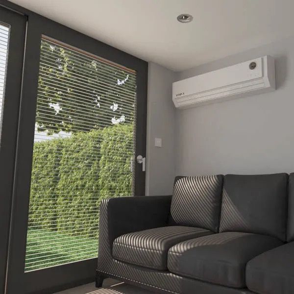 Garden room air conditioning installation in UK home, wall mounted heating and cooling system in modern garden office or studio, efficient quiet AC unit for year round comfort in outdoor garden buildings www.airomax.co.uk